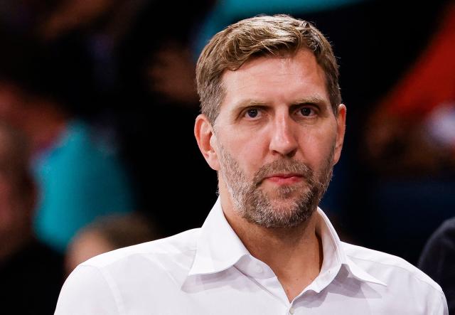 (FILES) In this file photo taken on June 19, 2025 former German basketball player Dirk Nowitzki is seen during the group stage basketball match between Germany and Sweden at the European Women's Basketball Championship in Hamburg. As he is inducted into the FIBA Hall of Fame, Dallas Mavericks and German basketball legend Dirk Nowitzki is typically humble in downplaying his role in changing the game. (Photo by FRANK MOLTER / AFP)