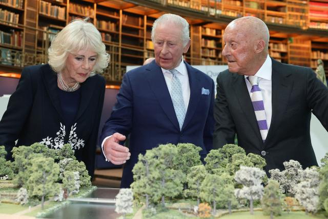 Britain's King Charles III (C) and Britain's Queen Camilla talk with architect Norman Foster (R) as they attend a presentation on the final design recommendation for the Queen Elizabeth Memorial, during a visit to the British Museum in central London on April 21, 2026, on the day marking what would have been the late monarch's 100th birthday. (Photo by Toby Melville / POOL / AFP)