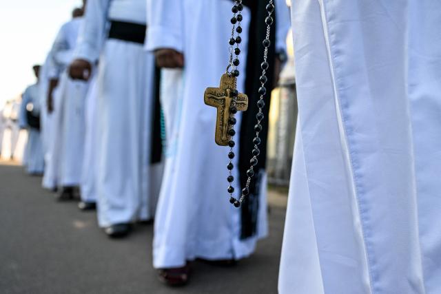 Sri Lanka’s Catholic priests take part in a silent march outside St. Sebastian’s Church in Katuwapitiya on April 21, 2026 marking the seventh anniversary of the 2019 Easter Sunday bombings. The United Nations urged Sri Lanka on April 21 to deliver concrete results after long-running investigations into the 2019 Easter Sunday suicide bombings that killed 279 people, including 45 foreigners. (Photo by Ishara S. KODIKARA / AFP)