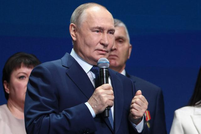 In this pool photograph distributed by the Russian state agency Sputnik, Russia's President Vladimir Putin attends a ceremony for the Sluzhenie All-Russian Municipal Service Awards in Moscow on April 21, 2026. (Photo by Sergei Bulkin / POOL / AFP)