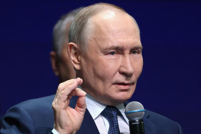 In this pool photograph distributed by the Russian state agency Sputnik, Russia's President Vladimir Putin attends a ceremony for the Sluzhenie All-Russian Municipal Service Awards in Moscow on April 21, 2026. (Photo by Sergei Bulkin / POOL / AFP)