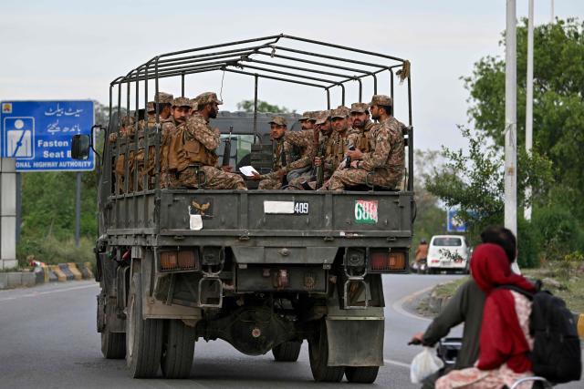 Army personnel patrol a street near the Serena Hotel, that hosted the first round of US-Iran negotiations during the Middle East war, at the Red Zone area in Islamabad on April 21, 2026, amid heightened security measures ahead of anticipated second round of US-Iran peace talks. Mediator Pakistan has yet to receive a formal response from Iran on whether it would send a delegation for a second round of talks with the United States, Islamabad's information minister said on April 21. (Photo by Asif HASSAN / AFP)