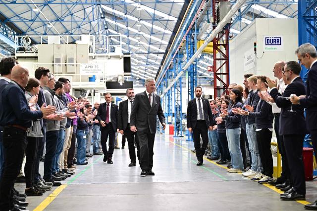 King Philippe - Filip of Belgium (C)  visits the Sonaca aerospace company in Gosselies on April 21, 2026. The Belgian king is on a two-day interregional business visit to Flanders and Wallonia, organised with the Flemish and Walloon business networks VOKA and AKT, with 40 business leaders from both regions. (Photo by DIRK WAEM / Belga / AFP) / Belgium OUT