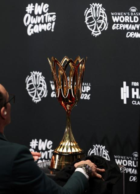 The FIBA Women's Basketball World Cup trophy is displayed prior to the FIBA Women's Basketball 2026 World Cup draw in Berlin on April 21, 2026. The final round of the 2026 FIBA Women's Basketball World Cup is scheduled to take place in September 2026 in Berlin. (Photo by Odd ANDERSEN / AFP)