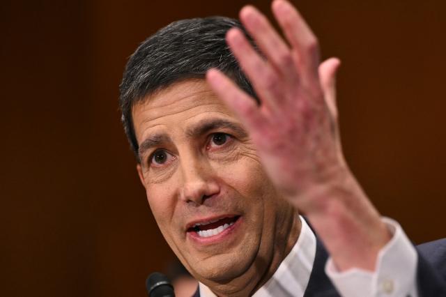 Kevin Warsh, nominee for US Federal Reserve Chair, testifies during a Senate Banking Committee hearing on his nomination on Capitol Hill in Washington, DC, on April 21, 2026. Warsh, President Donald Trump's choice to lead the US Federal Reserve, vowed Tuesday to protect central bank independence at his confirmation hearing, despite intense pressure from the president. (Photo by Mandel NGAN / AFP)