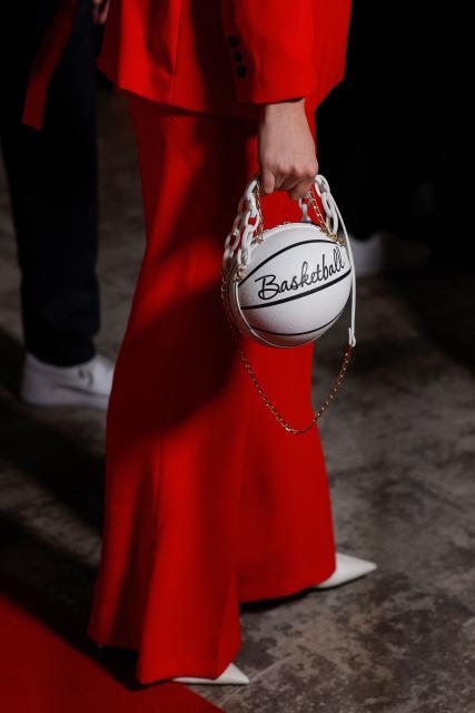 A guest with a basketball shaped handbag arrives for the FIBA Women's Basketball 2026 World Cup draw and FIBA Hall of Fame 2026 Induction ceremony in Berlin on April 21, 2026. (Photo by Odd ANDERSEN / AFP)