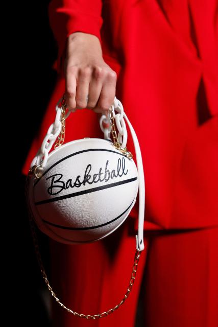 A guest with a basketball shaped handbag arrives for the FIBA Women's Basketball 2026 World Cup draw and FIBA Hall of Fame 2026 Induction ceremony in Berlin on April 21, 2026. (Photo by Odd ANDERSEN / AFP)
