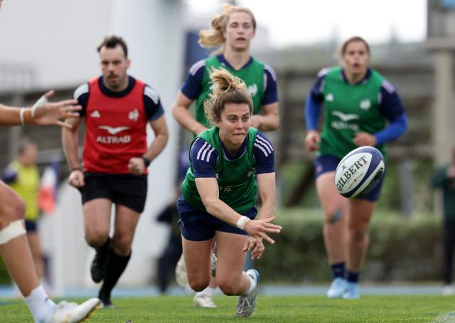 France's fly half Carla Arbez (C) passes the ball during a training session, as part of the preparation for the 6 Nations Rugby Union tournament match between France and Ireland in Marcoussis, south of Paris, on April 21, 2026. (Photo by FRANCK FIFE / AFP)