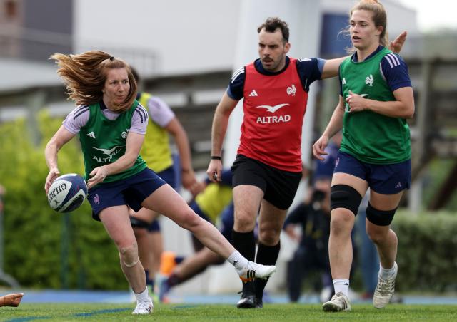 France's scrum half Pauline Bourdon Sansus (L) passes the ball during a training session, as part of the preparation for the 6 Nations Rugby Union tournament match between France and Ireland in Marcoussis, south of Paris, on April 21, 2026. (Photo by FRANCK FIFE / AFP)