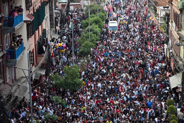 Devotees gather during the first day of the Rato Machindranath Jatra festival in Lalitpur on April 21, 2026. (Photo by Prakash MATHEMA / AFP)