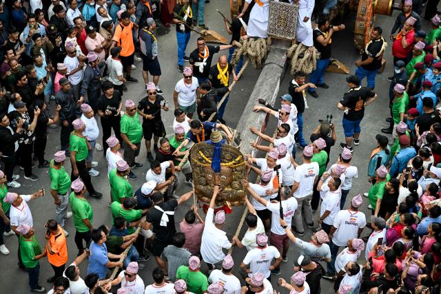 Devotees pull a chariot during the first day of the Rato Machindranath Jatra festival in Lalitpur on April 21, 2026. (Photo by Prakash MATHEMA / AFP)