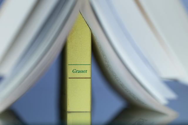 This illustration photograph shows a book from the Grasset publishing house in Paris on April 21, 2026. More than 100 authors at the Grasset imprint, home to some of the biggest names in French literature, said they would leave the publishing house after the surprise departure of its long-time CEO. (Photo by Joel Saget / AFP)