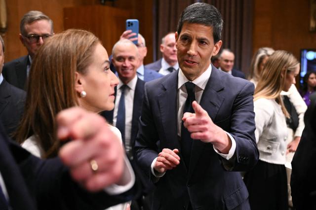 Kevin Warsh, nominee for US Federal Reserve Chair, departs at the end of a Senate Banking Committee hearing on his nomination on Capitol Hill in Washington, DC, on April 21, 2026. Warsh, President Donald Trump's choice to lead the US Federal Reserve, vowed Tuesday to protect central bank independence at his confirmation hearing, despite intense pressure from the president. (Photo by Mandel NGAN / AFP)