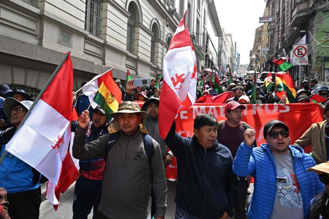 Rural education workers march through the central streets of La Paz on April 21, 2026, demanding a wage increase for their sector. (Photo by Aizar RALDES / AFP)