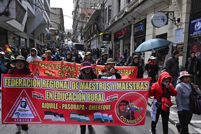 Rural education workers march through the central streets of La Paz on April 21, 2026, demanding a wage increase for their sector. (Photo by Aizar RALDES / AFP)