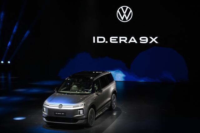 German automaker Volkswagen's new ID. ERA 9X electric SUV model is presented at an event ahead of the Beijing Auto Show 2026 in Beijing on April 21, 2026. (Photo by Pedro PARDO / AFP)
