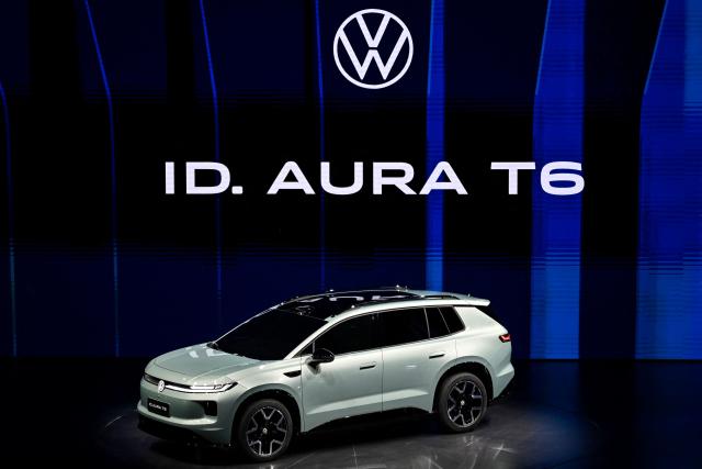 German automaker Volkswagen's new ID. AURA T6 electric SUV model is presented at an event ahead of the Beijing Auto Show in Beijing on April 21, 2026. (Photo by Pedro PARDO / AFP)