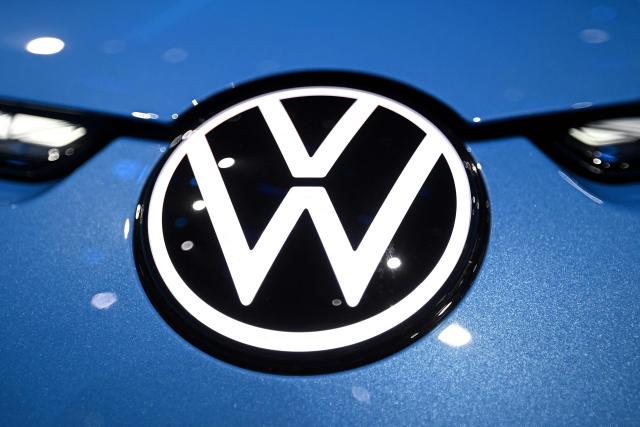 The logo of German automaker Volkswagen is pictured on their new ID. UNYX 09 electric car model during its presentation at an event ahead of the Beijing Auto Show 2026 in Beijing on April 21, 2026. (Photo by Pedro PARDO / AFP)