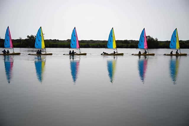 Catamaran sailboats from the Valras-Plage sailing school set sail for a lesson on March 21, 2026. (Photo by Gabriel BOUYS / AFP)