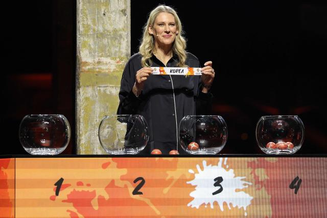 Lauren Jackson, Australian former basketball player, draws Korea out of the pot to go in to Group B during the FIBA Women's Basketball 2026 World Cup draw in Berlin on April 21, 2026. (Photo by Odd ANDERSEN / AFP)