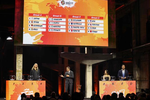 The results of the FIBA Women's Basketball 2026 World Cup draw are seen on the display after the names were drawn by Lauren Jackson (L), Australian former basketball player, German handball player Stefan Kretzschmar (R) and German breakdancer Bgirl Jilou (2nd R) at a ceremony in Berlin on April 21, 2026. (Photo by Odd ANDERSEN / AFP)