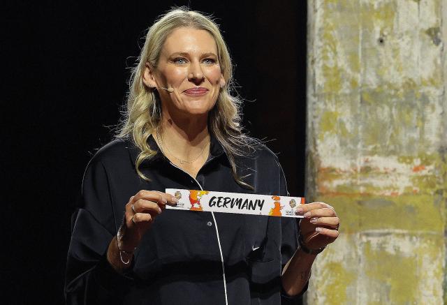 Lauren Jackson, Australian former basketball player, draws Germany out of the pot to go in to Group A during the FIBA Women's Basketball 2026 World Cup draw in Berlin on April 21, 2026. (Photo by Odd ANDERSEN / AFP) / ALTERNATIVE CROP