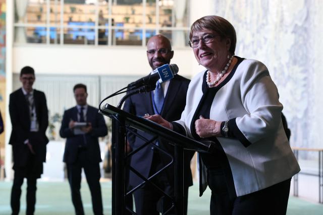 Former Chilean president Michelle Bachelet speaks to the press after a hearing to be considered as the next Secretary-General of the United Nations at the UN Headquarters in New York, on April 21, 2026. Bachelet is among four candidates vying for the position currently held by Portugal's Antonio Guterres. (Photo by TIMOTHY A. CLARY / AFP)