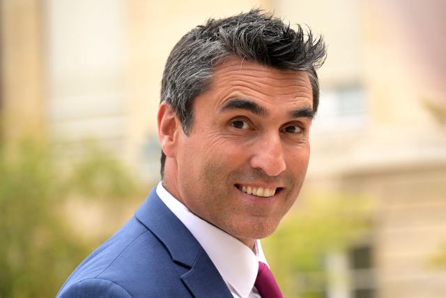 (FILES) French newly-elected MP for the far-right Rassemblement National (RN) political party Michael Taverne reacts as he arrives for a welcoming day at the National Assembly in Paris, on July 2, 2024. The investigation by the National Financial Prosecutor’s Office (PNF) targeting far right National Rally (RN) MP Michaлl Taverne for embezzlement is “nearing completion,” a judicial source told AFP on April 21, 2026, confirming a report by French weekly newspaper Le Canard enchaоnй. According to Le Canard enchaоnй, Michaлl Taverne is suspected of having continued to receive his police salary after taking his seat in the National Assembly in June 2022. (Photo by Bertrand GUAY / AFP)