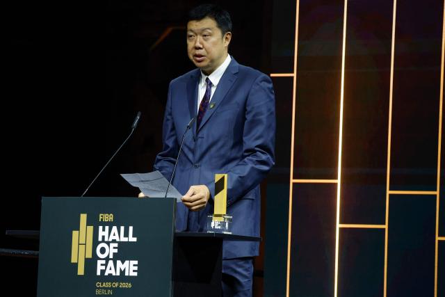 Chinese former basketball player Wang Zhizhi speaks after receiving his award the International Basketball Federation FIBA Hall of Fame 2026 Induction ceremony in Berlin on April 21, 2026. (Photo by Odd ANDERSEN / AFP)
