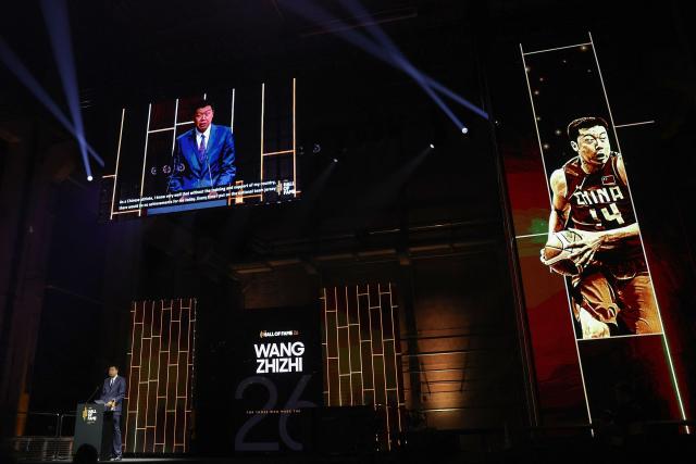 Chinese former basketball player Wang Zhizhi speaks after receiving his award the International Basketball Federation FIBA Hall of Fame 2026 Induction ceremony in Berlin on April 21, 2026. (Photo by Odd ANDERSEN / AFP)