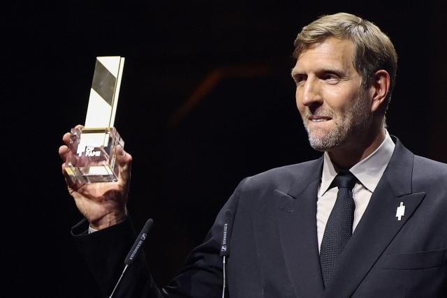 German former basketball player Dirk Nowitzki reacts after receiving his award at the International Basketball Federation FIBA Hall of Fame 2026 Induction ceremony in Berlin on April 21, 2026. (Photo by Odd ANDERSEN / AFP) / ALTERNATIVE CROP