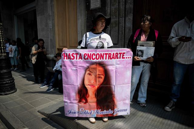 Relatives of disappeared people take part in a protest outside the Cultural Center for Spain in Mexico City on April 21, 2026, while UN High Commissioner for Human Rights Volker Turk holds a meeting inside the building. (Photo by Carl de Souza / AFP)