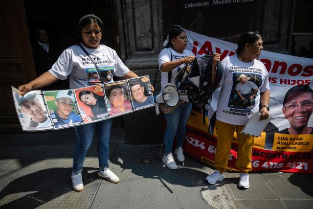 Relatives of disappeared people take part in a protest outside the Cultural Center for Spain in Mexico City on April 21, 2026, while UN High Commissioner for Human Rights Volker Turk holds a meeting inside the building. (Photo by Carl de Souza / AFP)