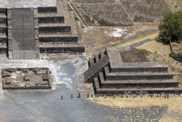 This aerial view shows forensic experts and prosecutor’s office personnel working at the Teotihuacan archaeological zone following a shooting in Teotihuacan, State of Mexico, on April 21, 2026. Mexican authorities said on April 21, 2026, that the man who killed a Canadian woman and wounded 13 others the day before at the famed Teotihuacan pyramids had planned the attack in advance. (Photo by RAY MARMOLEJO / AFP)