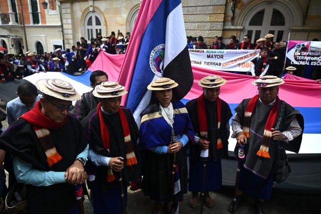 Misak Indigenous people protest to demand compliance with agreements reached with the government regarding their territories outside the Ministry of Foreign Affairs in Bogota on April 21, 2026. (Photo by Raul ARBOLEDA / AFP)
