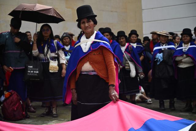 A Misak Indigenous woman takes part in a protest to demand compliance with agreements reached with the government regarding their territories outside the Ministry of Foreign Affairs in Bogota on April 21, 2026. (Photo by Raul ARBOLEDA / AFP)