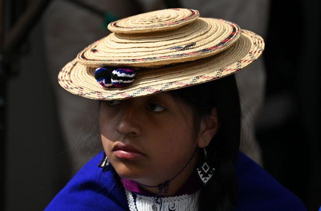 A Misak Indigenous woman takes part in a protest to demand compliance with agreements reached with the government regarding their territories outside the Ministry of Foreign Affairs in Bogota on April 21, 2026. (Photo by Raul ARBOLEDA / AFP)