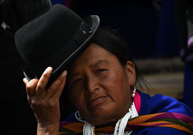 A Misak Indigenous woman takes part in a protest to demand compliance with agreements reached with the government regarding their territories outside the Ministry of Foreign Affairs in Bogota on April 21, 2026. (Photo by Raul ARBOLEDA / AFP)
