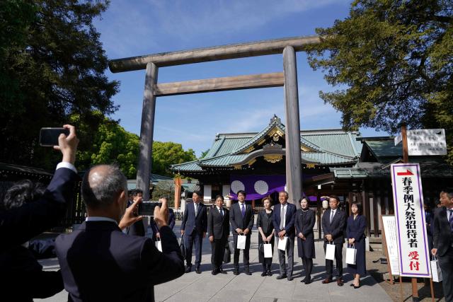 Japanese parliament members visit Yasukuni Shrine in Tokyo on April 22, 2026, as part of the shrine's three-day spring festival. (Photo by Kazuhiro NOGI / AFP)