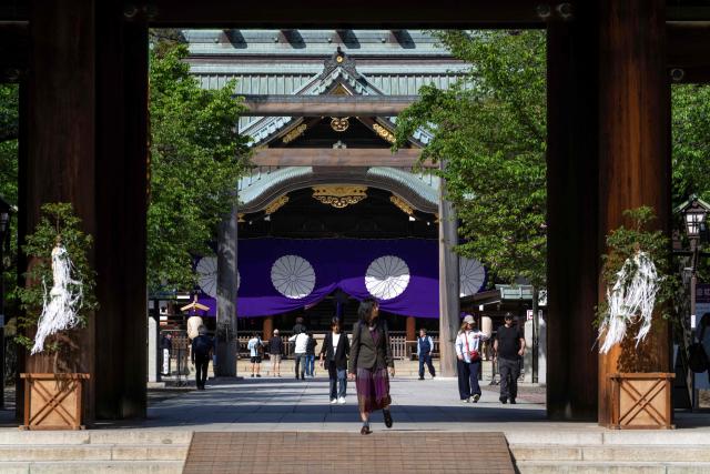 People visit Yasukuni Shrine in Tokyo on April 22, 2026, as part of the shrine's three-day spring festival. (Photo by Kazuhiro NOGI / AFP)
