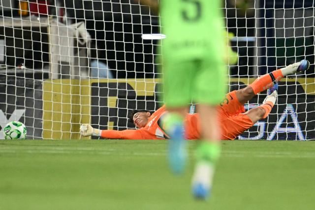 Pumas' goalkeeper #35 Pablo Lara can't stop a shot by Juarez's defender #33 Francisco Nevarez during a Pumas vs Juarez Mexican League football match in Mexico City on April 21, 2026. (Photo by YURI CORTEZ / AFP)