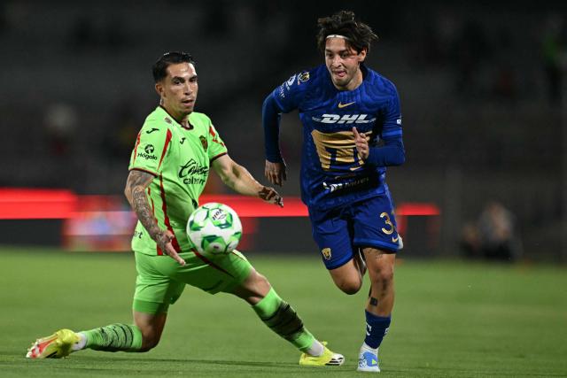 Juarez's defender #33 Francisco Nevarez (L) and Pumas' midfielder #33 Jordan Carrillo fight for the ball during a Pumas vs Juarez Mexican League football match in Mexico City on April 21, 2026. (Photo by YURI CORTEZ / AFP)