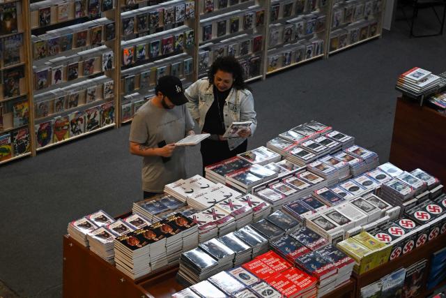 People browse books at the International Book Fair in Bogota on April 21, 2026. (Photo by Raul ARBOLEDA / AFP)