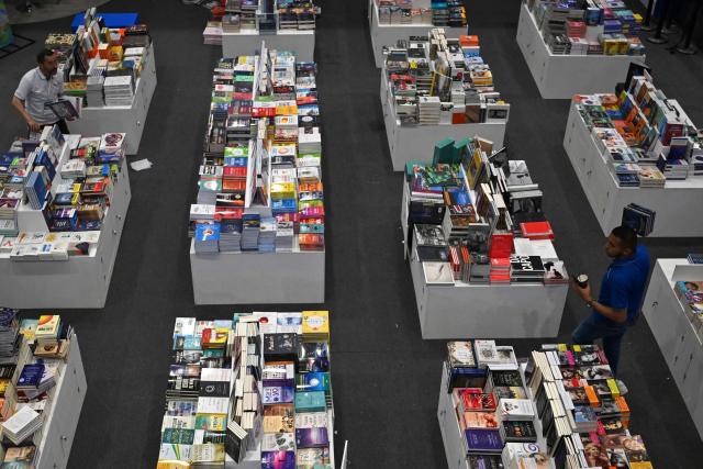 Books are on display at the International Book Fair in Bogota on April 21, 2026. (Photo by Raul ARBOLEDA / AFP)