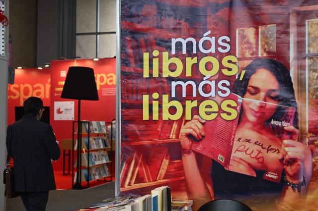 A man attends the International Book Fair in Bogota on April 21, 2026. (Photo by Raul ARBOLEDA / AFP)