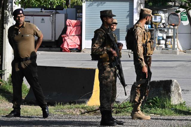 Army soldiers stand along a closed street leading to the Serena Hotel at the Red Zone area in Islamabad on April 22, 2026. Pakistani Prime Minister Shehbaz Sharif thanked US President Donald Trump on April 22, for extending a ceasefire with Iran that had been soon set to expire and urged both sides to continue talks. (Photo by Aamir QURESHI / AFP)