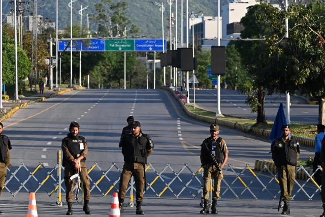 Police officers stand guard at a closed road leading to the Serena Hotel at the Red Zone area in Islamabad on April 22, 2026. Pakistani Prime Minister Shehbaz Sharif thanked US President Donald Trump on April 22, for extending a ceasefire with Iran that had been soon set to expire and urged both sides to continue talks. (Photo by Aamir QURESHI / AFP)