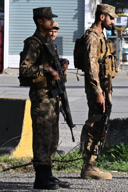 Army soldiers stand along a closed street leading to the Serena Hotel at the Red Zone area in Islamabad on April 22, 2026. Pakistani Prime Minister Shehbaz Sharif thanked US President Donald Trump on April 22, for extending a ceasefire with Iran that had been soon set to expire and urged both sides to continue talks. (Photo by Aamir QURESHI / AFP)