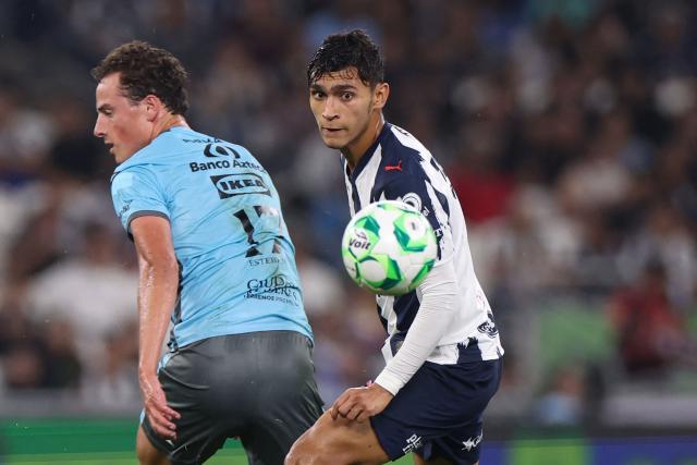 Puebla's forward #17 Esteban Lozano and Monterrey's midfielder #05 Fidel Ambriz fight for the ball during a Monterrey vs Puebla Mexican League football match in Monterrey, Nuevo Leon state, Mexico, on April 21, 2026. (Photo by Julio Cesar AGUILAR / AFP)