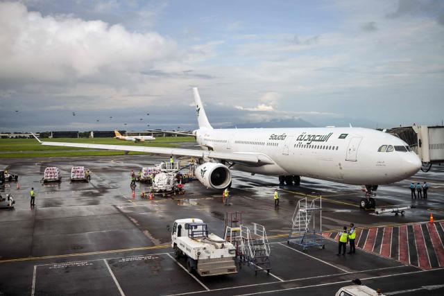 A Saudia Airlines plane is seen on the tarmac before departing for the holy city of Mecca for the annual Hajj, at Juanda International Airport in Sidoarjo on April 22, 2026. (Photo by JUNI KRISWANTO / AFP)